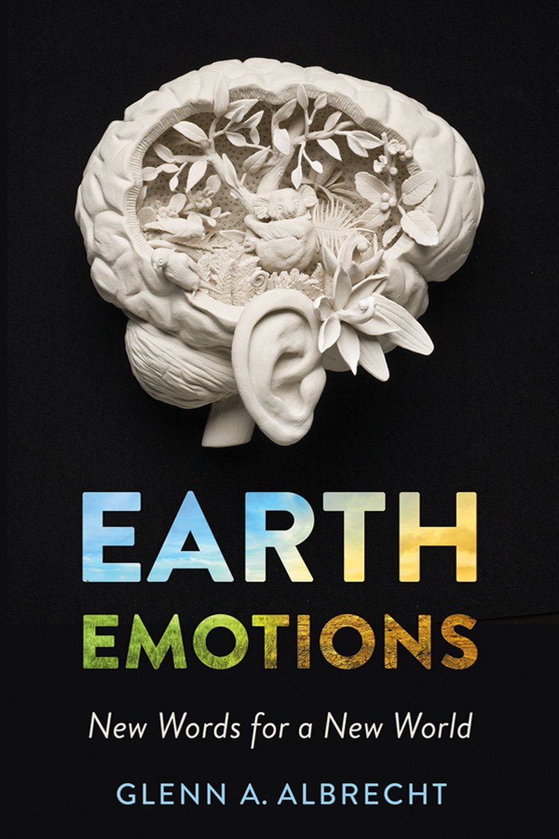 Book cover of Earth Emotions by Glenn A. Albrecht with a nature-filled skull sculpture