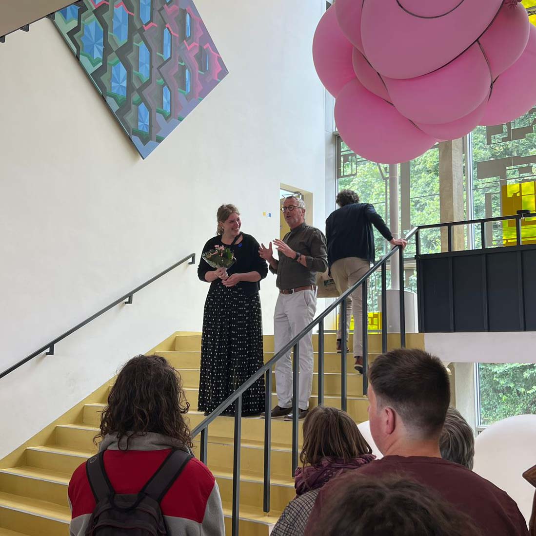 Flore Hanna Wormskamp receives flowers on the steps at the presentation of an encouragement prize
